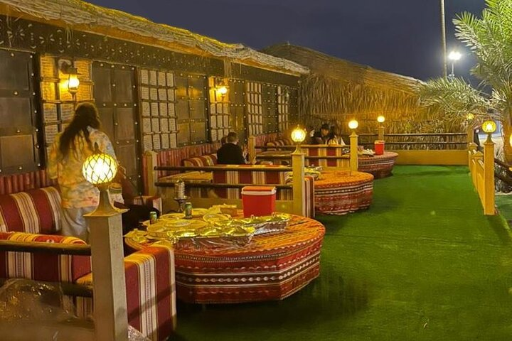 Experience the serene beauty of Dubai's desert from a private terrace indulging in luxury and rich cultural entertainment while savoring exquisite cuisine under the stars.